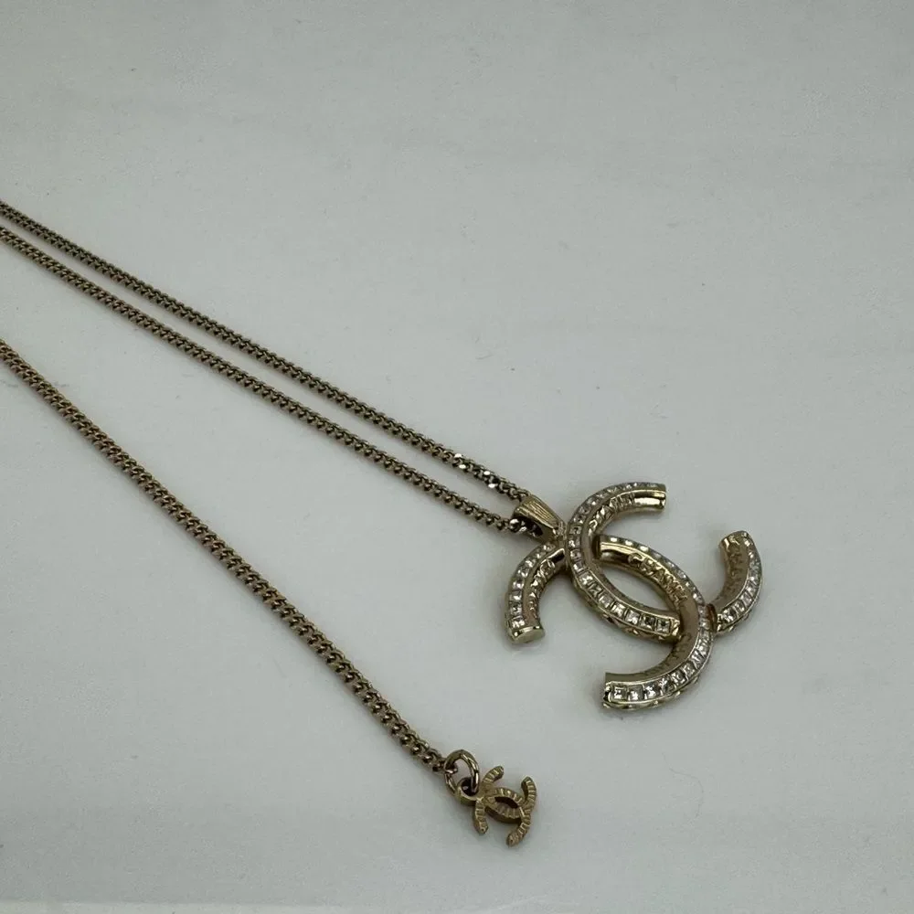 CHANEL Multi Logo Engraved Gold Crystal CC Pendant Necklace